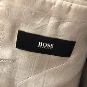 Hugo Boss. Suit 42 R.  Ink slightly visible outside. See photo.  Visible inside